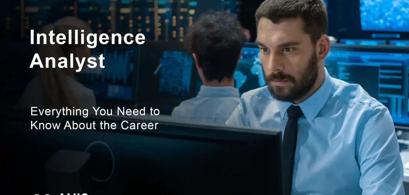 Intelligence Analyst Career Guide 2025 Intelligence analyst reviewing data on multiple computer screens in secure facility