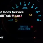 Service StabiliTrak warning light illuminated on Chevrolet dashboard indicating stability control system malfunction