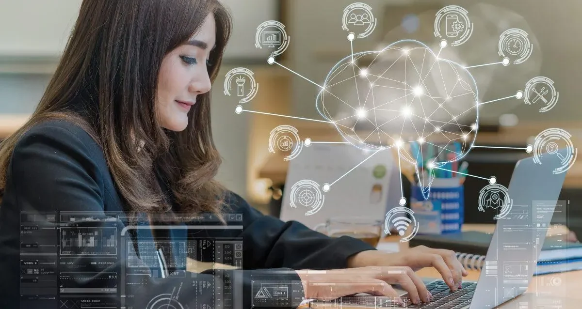 Navigating to Work 2026 Professional working on laptop in modern hybrid workspace showing blend of remote and office work in 2026