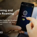 Shocked traveler looking at expensive roaming and data roaming charges on phone bill showing $2000+ costs