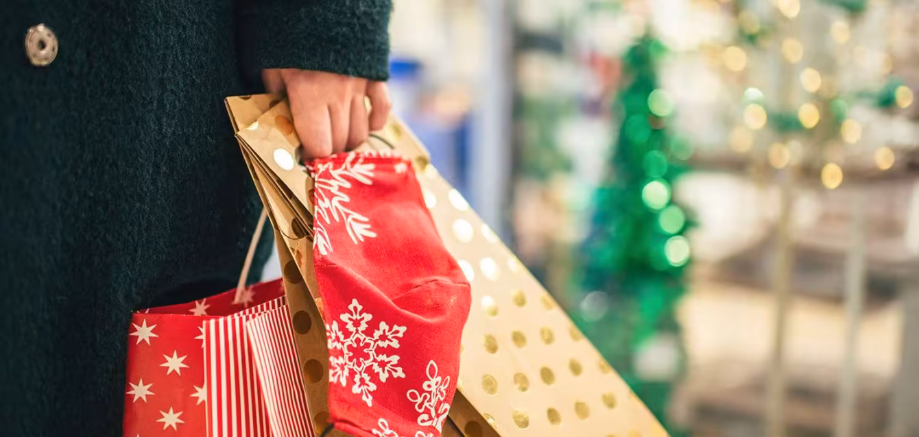 holiday-shopping-statistics Holiday shopping statistics 2026 chart showing trillion U.S. holiday sales forecast and 3.3% real growth on the Axis Holiday Volume Gauge 2026 holiday sales forecast comparison of nominal growth, headline-CPI-deflated growth and real holiday goods volume growth